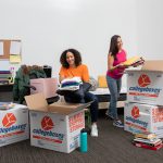Two freshmen college students pack up their dorm room essentials for the school year.
