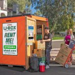 Moving Help Service Providers load a customer's belongings into a U-Box storage container.