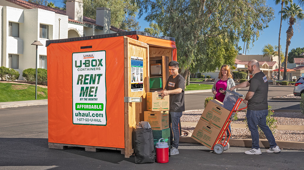 Moving Help Service Providers load a customer's belongings into a U-Box storage container.
