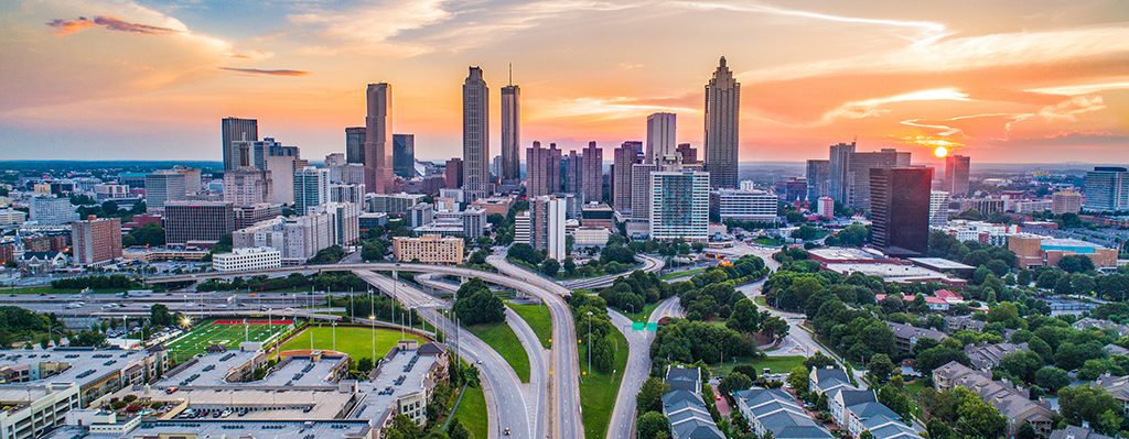 Atlanta’s downtown can be seen as the sun begins to set in the background.