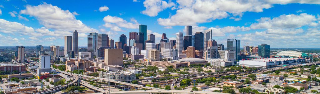 In the background is Houston’s downtown area, which can be seen during a sunny afternoon.