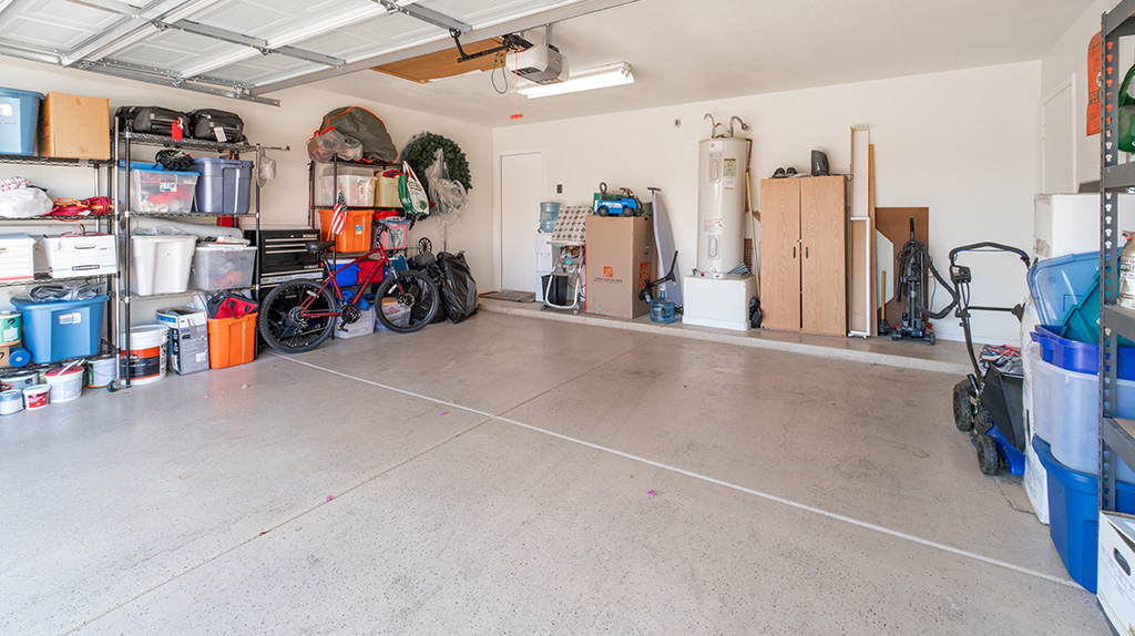 A well-organized garage can be seen as sunlight shines into the garage.