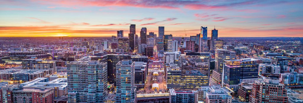 The beautiful Denver skyline can be seen in downtown Denver as the sun begins to set.