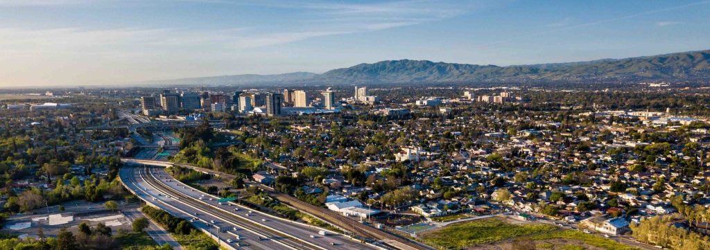 San Jose’s downtown area can be seen in the background as cars drive to and from the city.