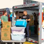 A local Service Provider loads a couple’s belongings from their storage unit into their U-Haul truck rental. Professional Moving Helpers can load or unload storage units.