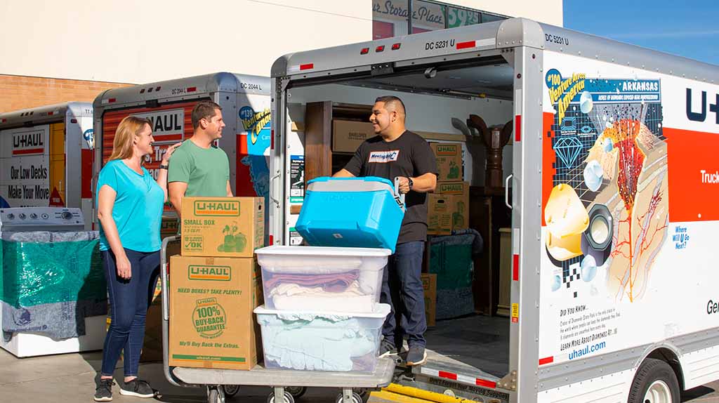 A local Service Provider loads a couple’s belongings from their storage unit into their U-Haul truck rental. Professional Moving Helpers can load or unload storage units.