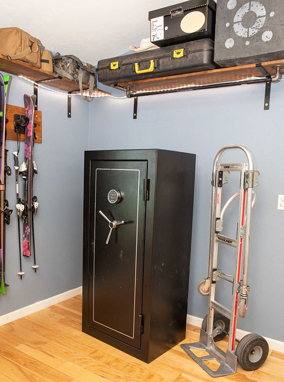 A dolly stands next to a gun safe. Moving guns and a gun safe safely is paramount. The Moving Help Marketplace has moving labor providers who can move your gun safe for you.