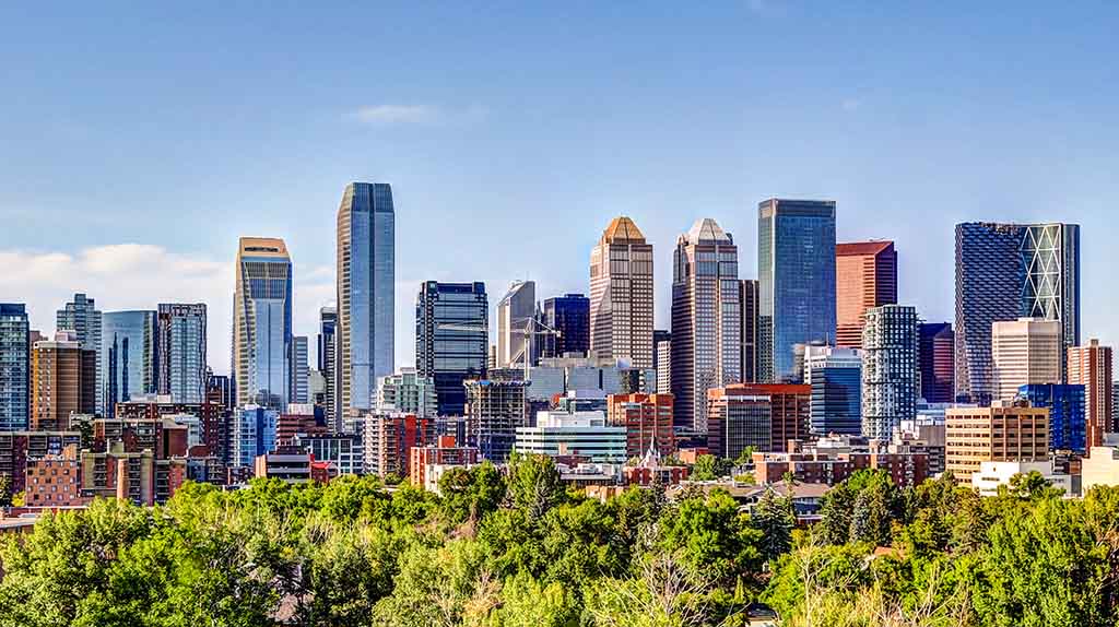 The Calgary skyline can be seen on a sunny afternoon in Calgary.