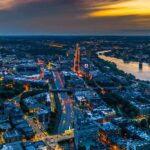 An aerial shot of downtown Boston can be seen during the evening.
