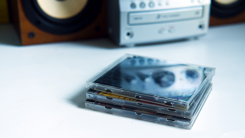 CD cases lay on a table.