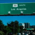 A freeway sign reads "Los Angeles."