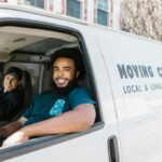 Two movers drive to a job in New York City.