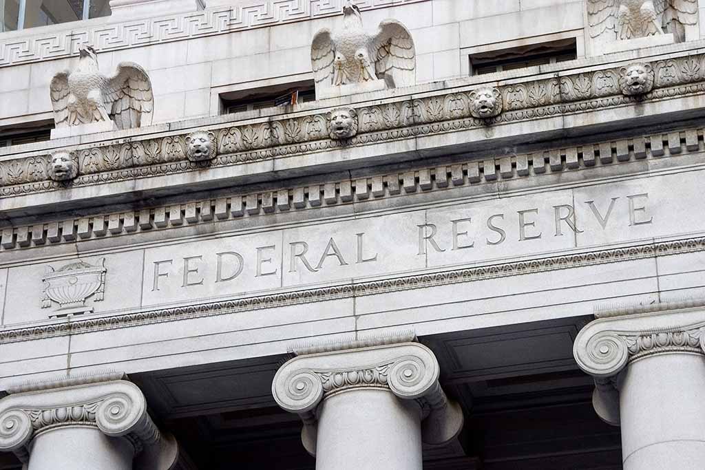 The outside of the Federal Reserve building can be seen on a cloudy day.